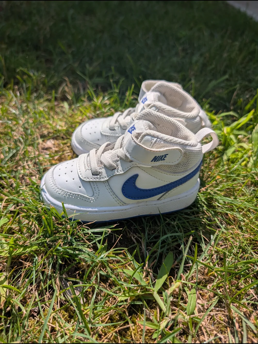 Nike Toddler White Sneakers with Blue Swoosh